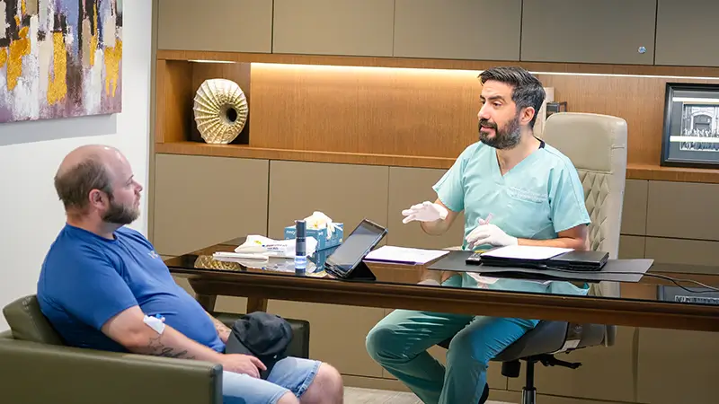 Dr. Aykut explaining procedure to patient